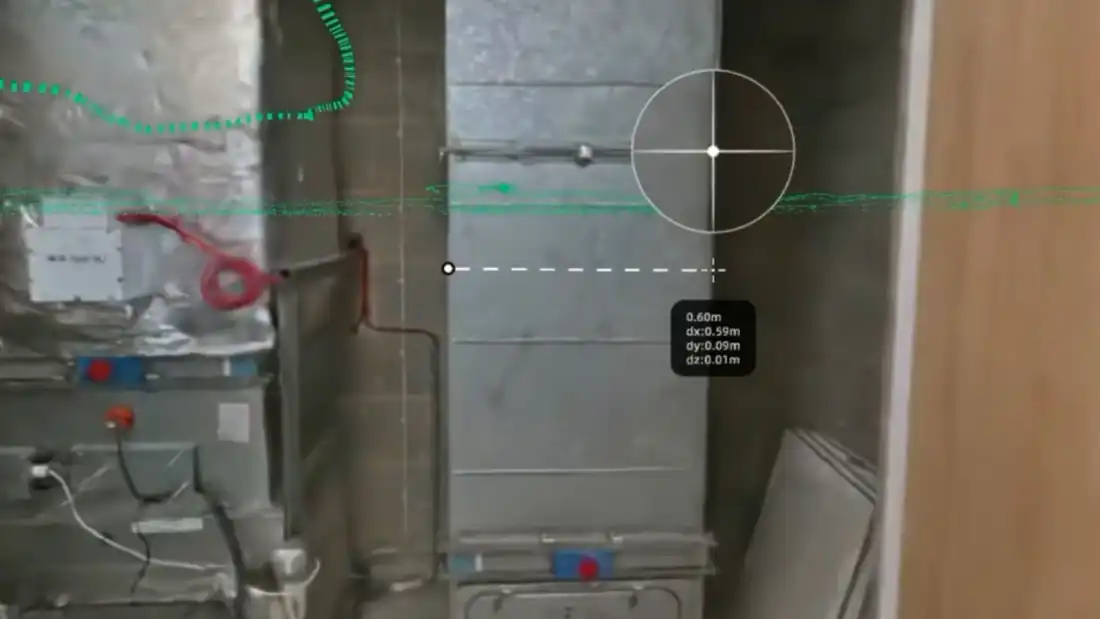 Photoreal navigable Gaussian splat environment of a plant room, being dimensioned from a desk